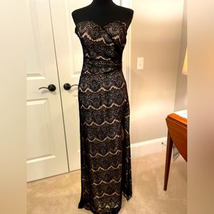 BeBe strapless full-length sheath dress with side slit.